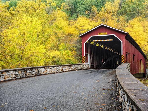 Unveiling Lancaster's Tech Evolution: A Legacy of Disruption A covered bridge in the midst of changing leaves shows Lancaster's traditional roots